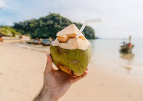 Fresh coconut on a beach in Thailand